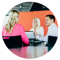 Team discussing technology services for client's business around table