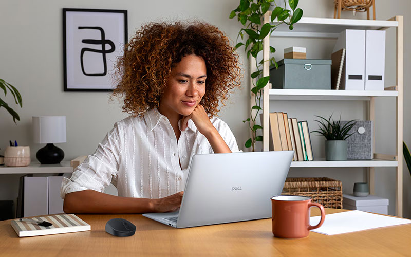 Woman working on Dell laptop