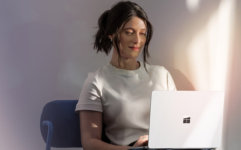 Microsoft Surface woman working on device