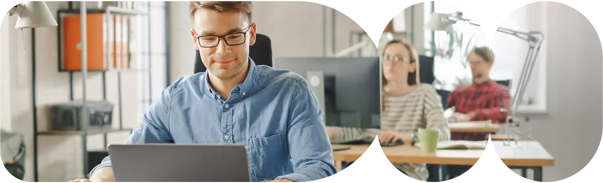 Team collaborating on laptops while conducting an AWS Well-Architected Framework Review to evaluate security and reliability.