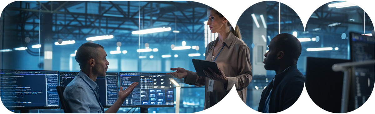 People on computer in data center.