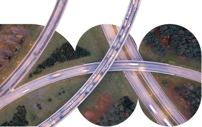Ariel view of a freeway with roads and trees.