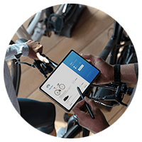 Person using a tablet for the bikeshop