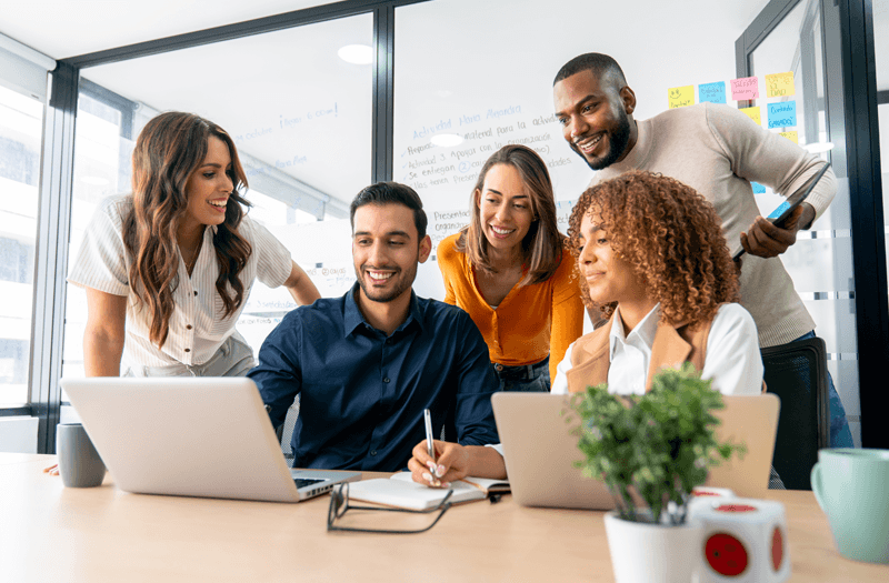 Businesswoman using laptop wioth Gemini Enterprise in office