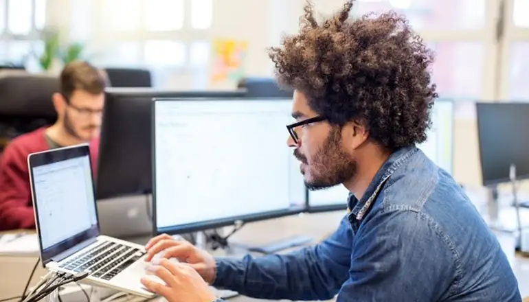 man working on laptop.