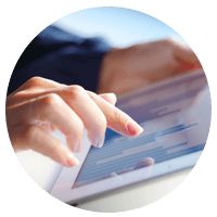 Hands using touch screen of tablet computer device 