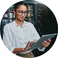 woman with tablet in server room