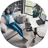 Woman relaxing in the living room while working