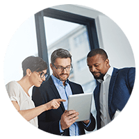 Group of business employees looking at tablet