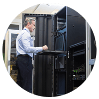 Business man working in server room