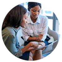 Two woman looking at tablet