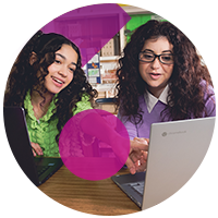 Two students using chromebook during class