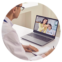 doctor monitoring patient remotely using laptop