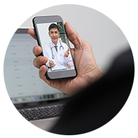 person holding phone with doctor on screen
