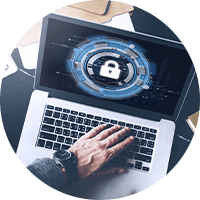 Person using a laptop with security icon