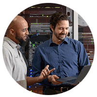 Two teammates talk through clients data center challenges