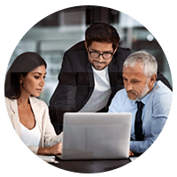 Group of managers review job candidate pre-screening results on laptop computer