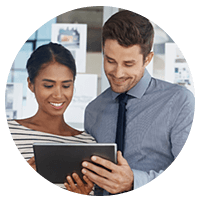 Two business professionals looking at tablet device