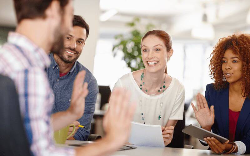 Collaborating teammates discuss new ideas