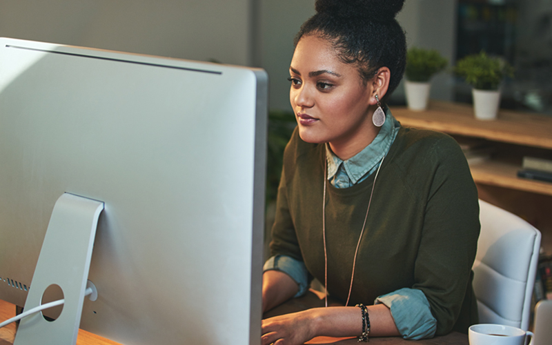 Businesswoman on desktop computer