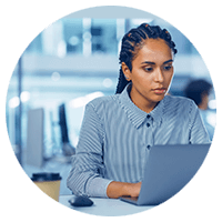 Woman in braids using a laptop