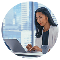 Woman typing using a laptop