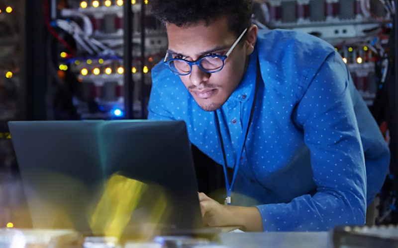 Man on Intel AI PC doing work.