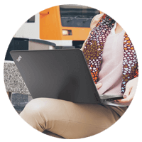 Woman working in notebook on lap 