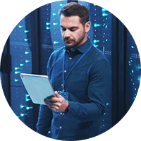 Man holding a tablet inside data center
