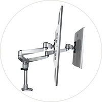 Office space with monitors and keyboard.