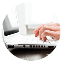 Close up of hands typing on a keyboard 