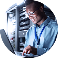 Man with glasses using a laptop