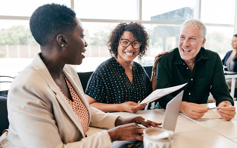 Employees in meeting discussing