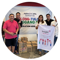 Insight Manila teammates holding up poster at event