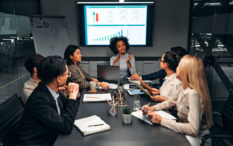 Team of business professionals in business analytics meeting