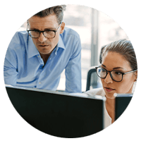 business coworkers looking at a computer screen