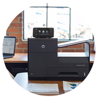 Printer located in front of office window.