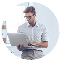 Business professional holds laptop computer