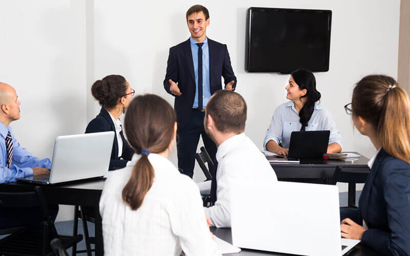 Manager presents new concept in business meeting