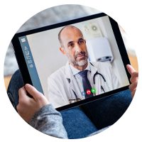 Doctor consulting patient on tablet via telehealth services