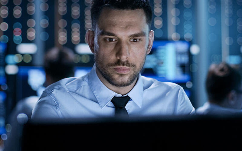 Man working on monitor screen