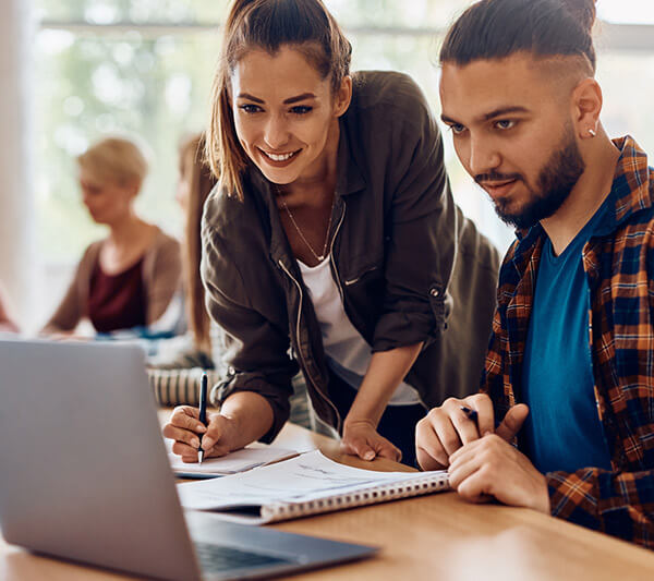 Teacher working with student