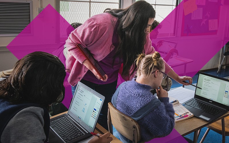 Elevate your institution with Google Workspace Teacher assisting student on laptop