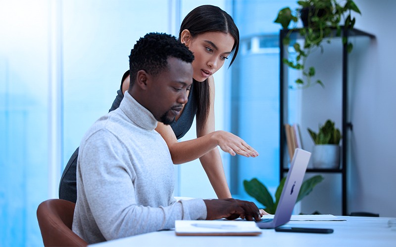 Man drawing design in front of computer