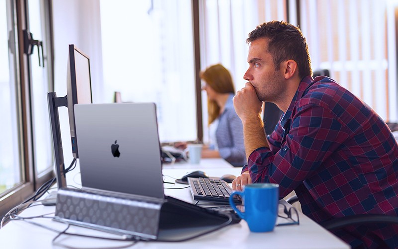 sec2_government_employee_working_macbook_pro_no_brand