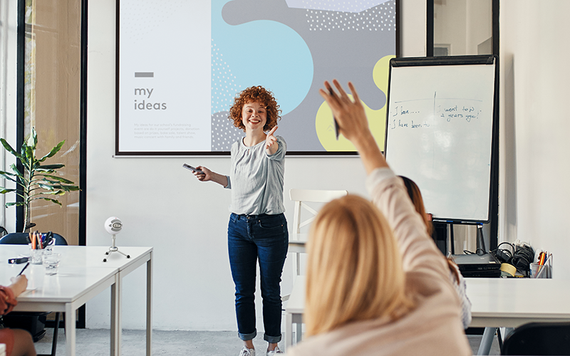 teacher presenting on whiteboard