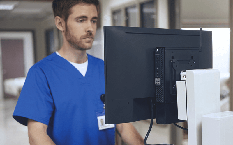 Healthcare worker working with Dell device
