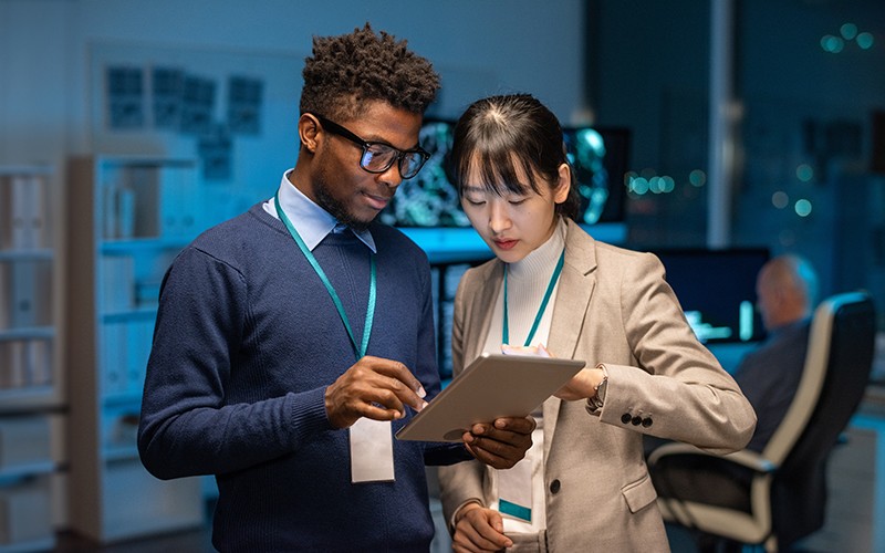 Supercharge your IT operations for a more secure enterprise. Two professionals collaborating