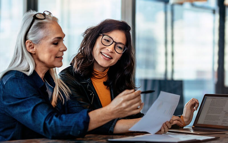 Project manager having discussion with designer