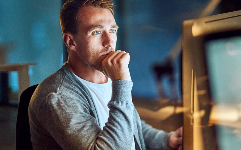 IT developer reviewing code found on system database